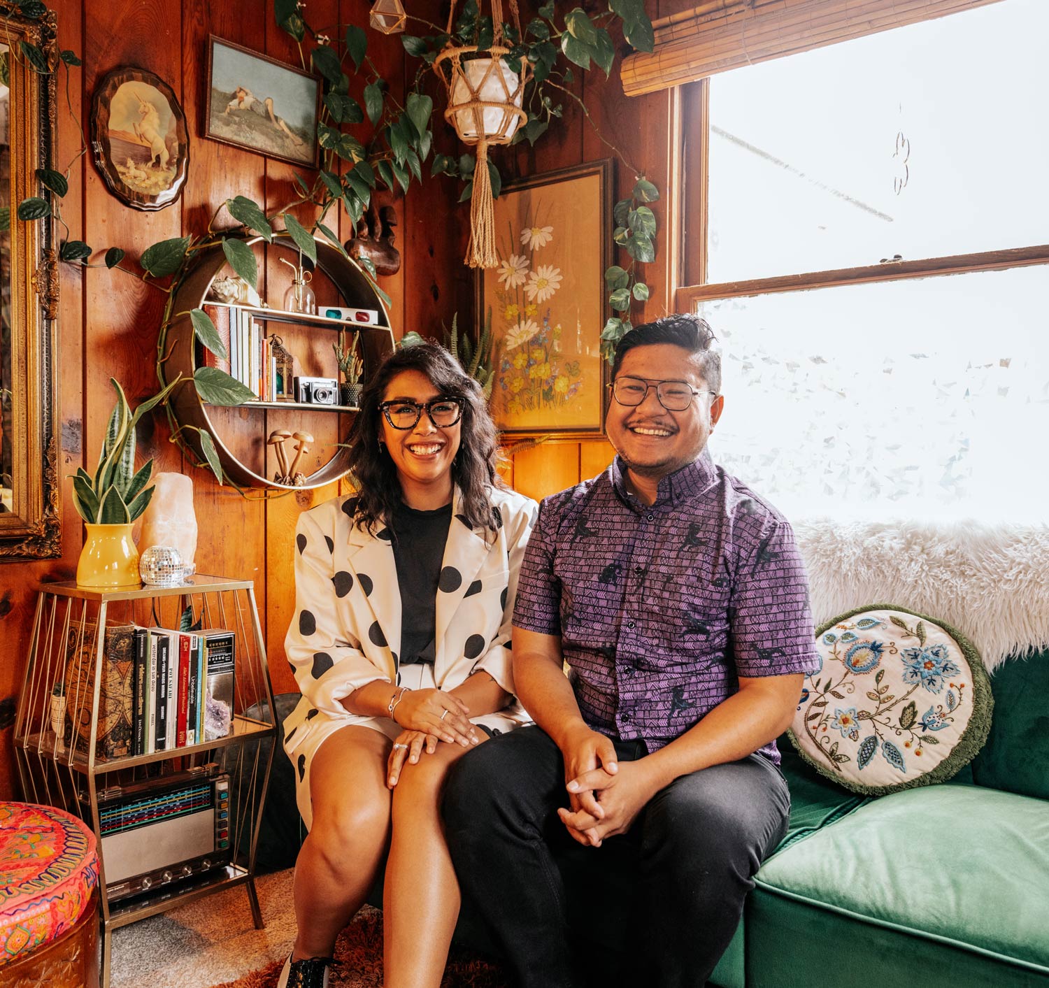 Jess and Nelson sitting on a couch close together